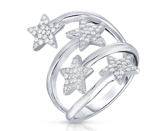 May include: A silver-toned bypass ring featuring a spiraling band design adorned with four star-shaped motifs. Each star is encrusted with small, clear, sparkling stones, creating a bright, reflective surface across the entire piece of jewelry.