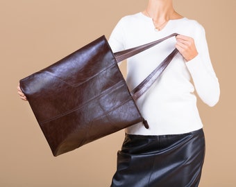 A beautiful luxury large  bag. Made of thick Italian leather in a deep chocolate dark brown color. This bag is the only one in this color!