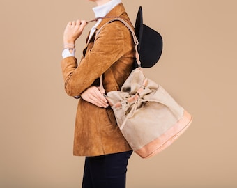 Classic medium-sized bag sack of whiten brown eco suede and beige faux leather, with a long adjustable strap, women's shoulder bag