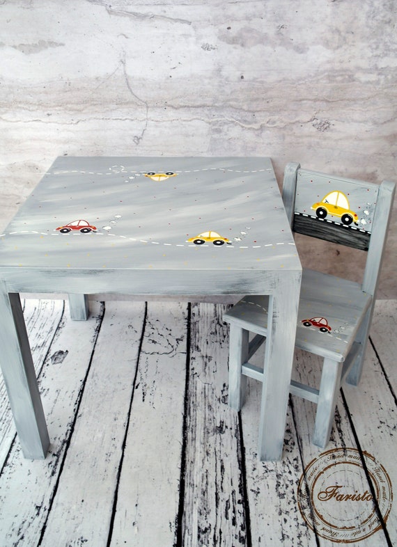 white wooden kids table and chairs