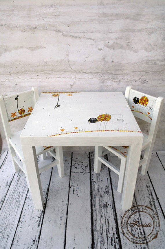 white wooden kids table and chairs