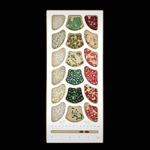 Acclaim Crafts Bead Stringers Pocket Board with a clean white top, 18 1/2" deep rounded pockets, and a handy measuring groove.