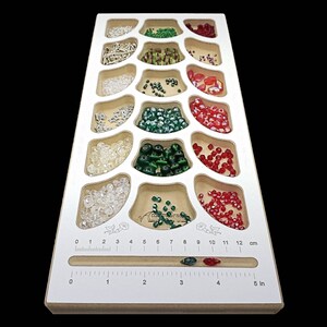 Acclaim Crafts Bead Stringers Pocket Board, 6 3/8 x15x3/4", with a clean white surface, 18 pockets, and a handy measuring groove.