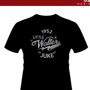 May include: Black t-shirt with a white graphic design featuring the text "1952 Little Walter "Juke"" and a harmonica. The back of the shirt has the text "Devil's Tale Music.com" in white.