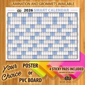 May include: A 2026 Smart Calendar with a white background and blue highlighted squares. The calendar includes the text "Lamination and Grommets Available", "Your Choice Poster or PVC Board", and "4 Sticky Pads Included". Four sticky pads in pink, yellow, and orange are in the foreground.