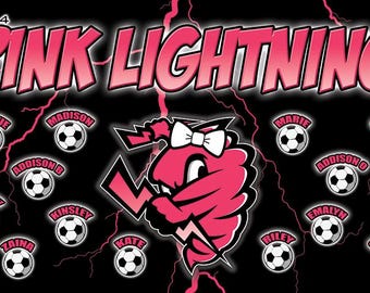 May include: A black and pink graphic design featuring the text "PINK LIGHTNING 2024". The design includes a pink lightning bolt mascot with a white bow, soccer balls, and names like Melanie, Madison, and Sophie.