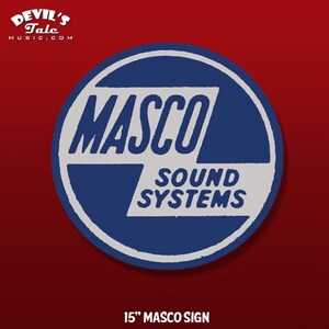 May include: A round blue and white sign with the text "MASCO SOUND SYSTEMS" in a bold, sans-serif font. The sign is 15 inches in diameter and features a white border and a red background. The Devil's Tale logo is in the upper left corner.