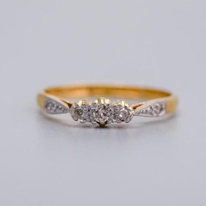 Solid 18K gold three stone platinum set diamond ring with clustered diamond shoulders