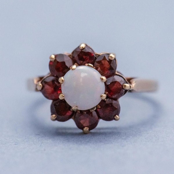 Solid 9K gold white opal and red garnet flower arrangement ring