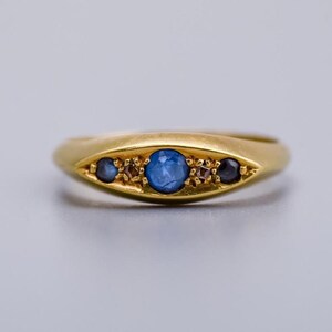 Solid 18K gold boat style ring with sapphires and diamonds