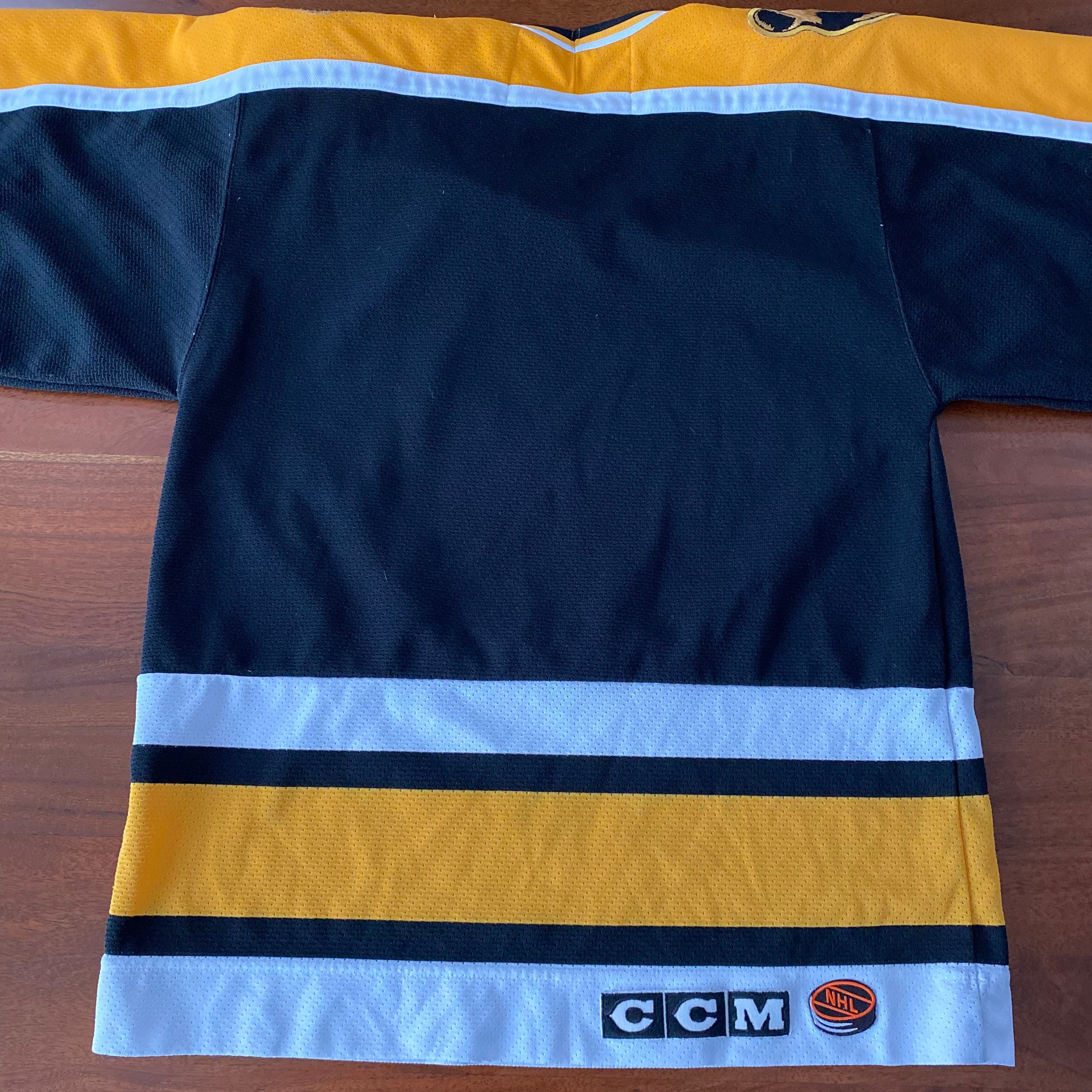 Boston Bruins white jersey appreciation post. 90s home and TBTC are Center  Ice Collection. Current away and Winter Classic are Made in Canada.  Bergeron on the right is CCM Vintage series. 