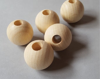 Wooden balls - made of beech - unpainted with a large hole for all kinds of craft work, macramé or for painting yourself