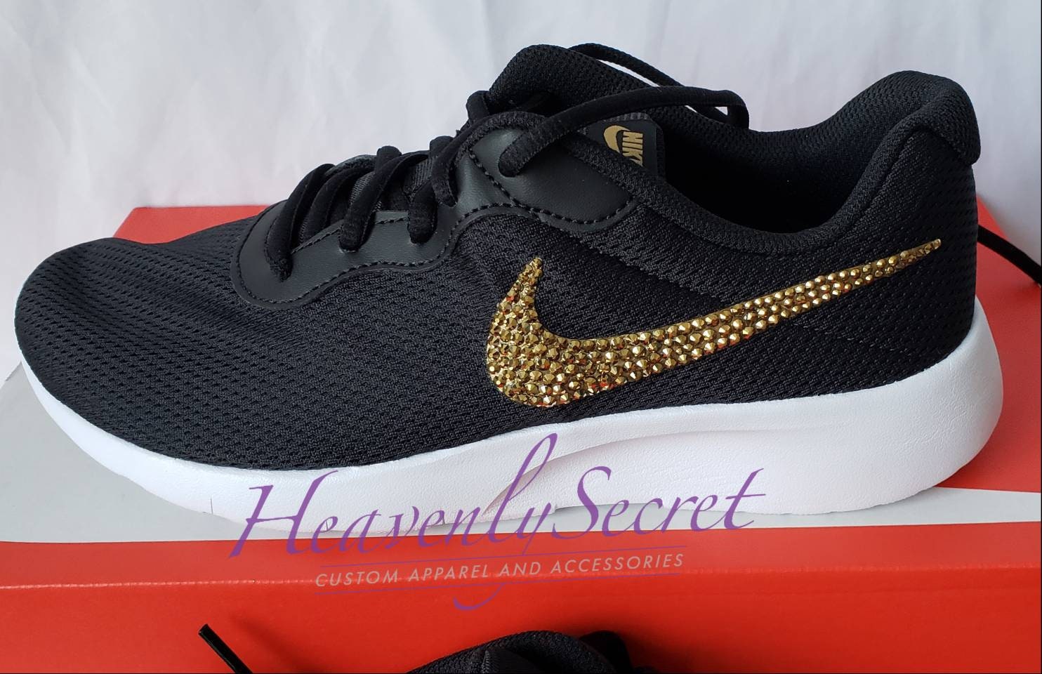 nike tanjun gold swoosh