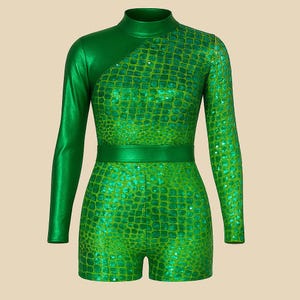 May include: A green, one-piece jumpsuit with a high neckline and long sleeves. The garment features a shiny, textured pattern on the torso and one sleeve, with a solid green material on the other sleeve and upper chest. A matching belt cinches the waist.