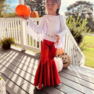 Rustic Elegance Ensemble: Off-Shoulder Fringe Top, Rust Flare Bell Bottoms, and Turquoise Concho Belt-By Wholesome Goods Co Fall Outfit image 5