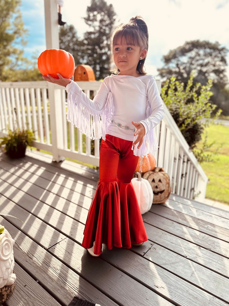 Rustic Elegance Ensemble: Off-Shoulder Fringe Top, Rust Flare Bell Bottoms, and Turquoise Concho Belt-By Wholesome Goods Co Fall Outfit image 5