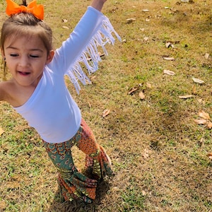 Retro Vibes: Bell Bottom Pants & One Shoulder Fringe Top for Kids - Trendy and Comfortable Outfit for Dancing and Playtime! WHOLESOME GOODS