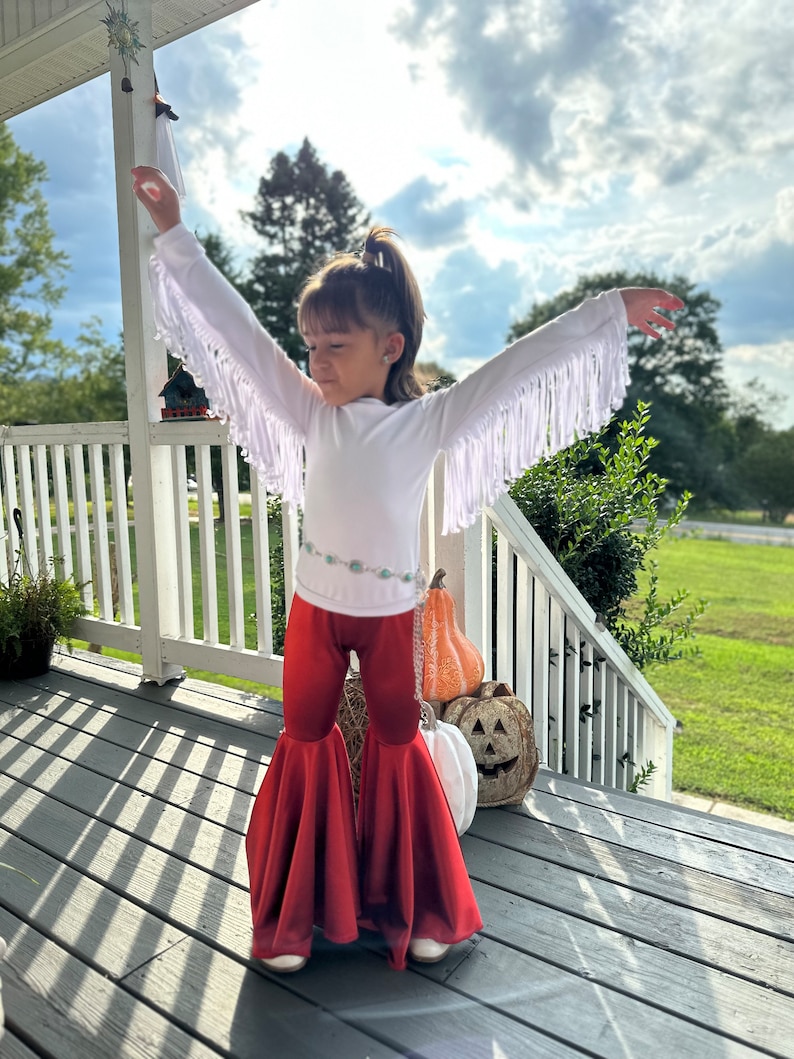 Rustic Elegance Ensemble: Off-Shoulder Fringe Top, Rust Flare Bell Bottoms, and Turquoise Concho Belt-By Wholesome Goods Co Fall Outfit image 4