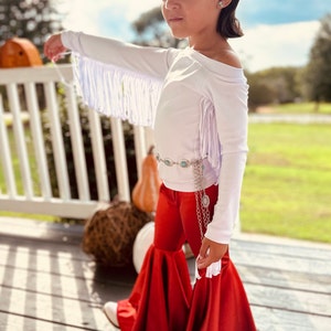 Rustic Elegance Ensemble: Off-Shoulder Fringe Top, Rust Flare Bell Bottoms, and Turquoise Concho Belt-By Wholesome Goods Co Fall Outfit image 2