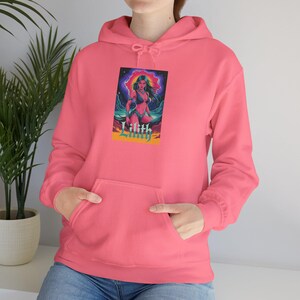 May include: A coral pink hoodie with a front pocket. The hoodie features a graphic of a woman with long green hair and the word "Lilith" in yellow and orange. The graphic is set against a colorful background of blues, purples, and pinks.