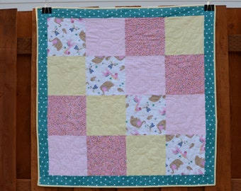 Handmade baby girl quilt with minky back