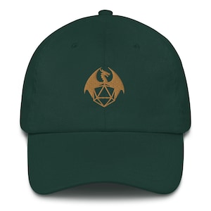 May include: A dark green baseball cap with a gold embroidered dragon and a dice symbol.