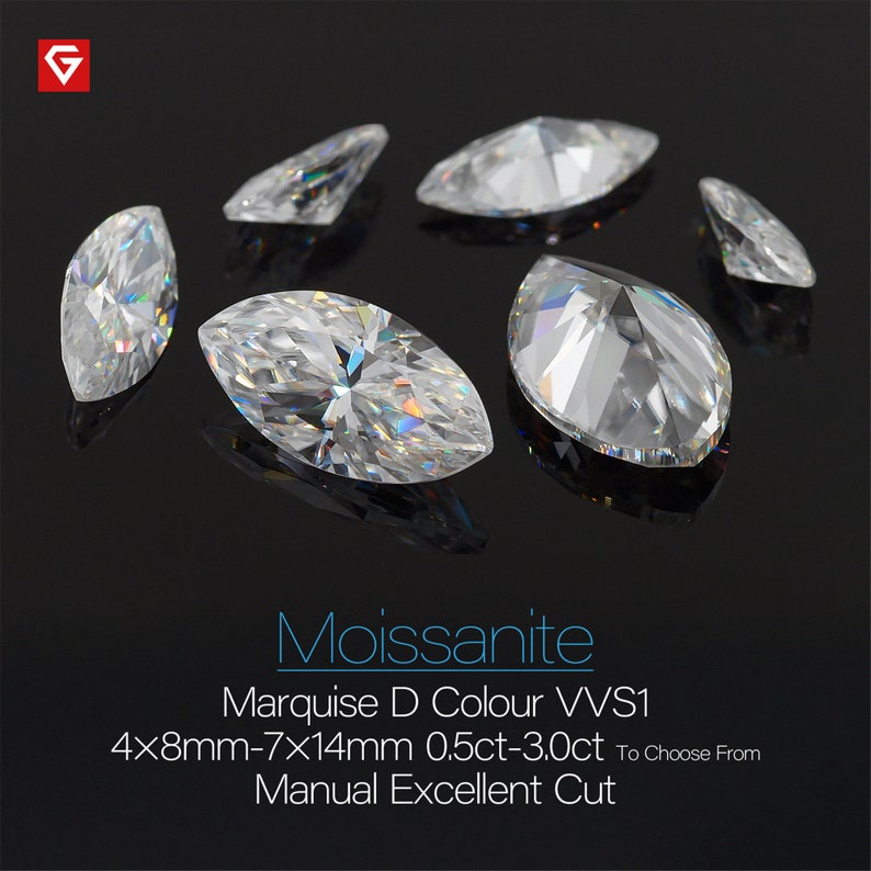 May include: A group of six clear marquise cut moissanite stones on a black background. The stones are 4x8mm-7x14mm and range in size from 0.5ct to 3.0ct. The stones are described as D color and VVS1 clarity. The text "Moissanite" is written in large letters at the bottom of the image. The text "Marquise D Colour VVS1" is written below the word "Moissanite". The text "4x8mm-7x14mm 0.5ct-3.0ct To Choose From" is written below the text "Marquise D Colour VVS1". The text "Manual Excellent Cut" is written below the text "4x8mm-7x14mm 0.5ct-3.0ct To Choose From".