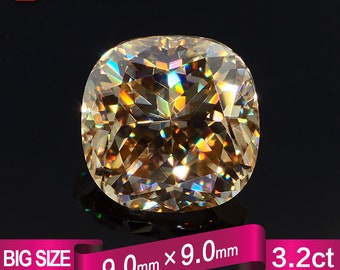 May include: A large, cushion-cut, light brown diamond gemstone with a brilliant, faceted surface. The diamond measures 9.0 mm x 9.0 mm and weighs 3.2 carats.