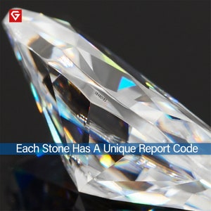 May include: Close-up of a clear, faceted gemstone with a unique report code, "18480193", etched on the side. Each stone has a unique report code.