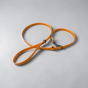 May include: A set of three ceramic canisters with lids, featuring a blue and white floral pattern. The canisters vary in size, with the largest measuring approximately 8 inches in height. They are likely used for kitchen storage.