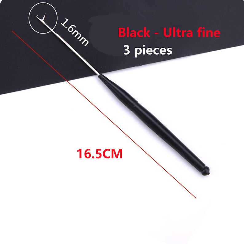 May include: A black ultra fine crochet hook measuring 16.5 cm in length with a 1.6 mm tip. The set includes 3 pieces. The tool features a slender metal hook and a black handle, with text on the image indicating Black - Ultra fine 3 pieces.