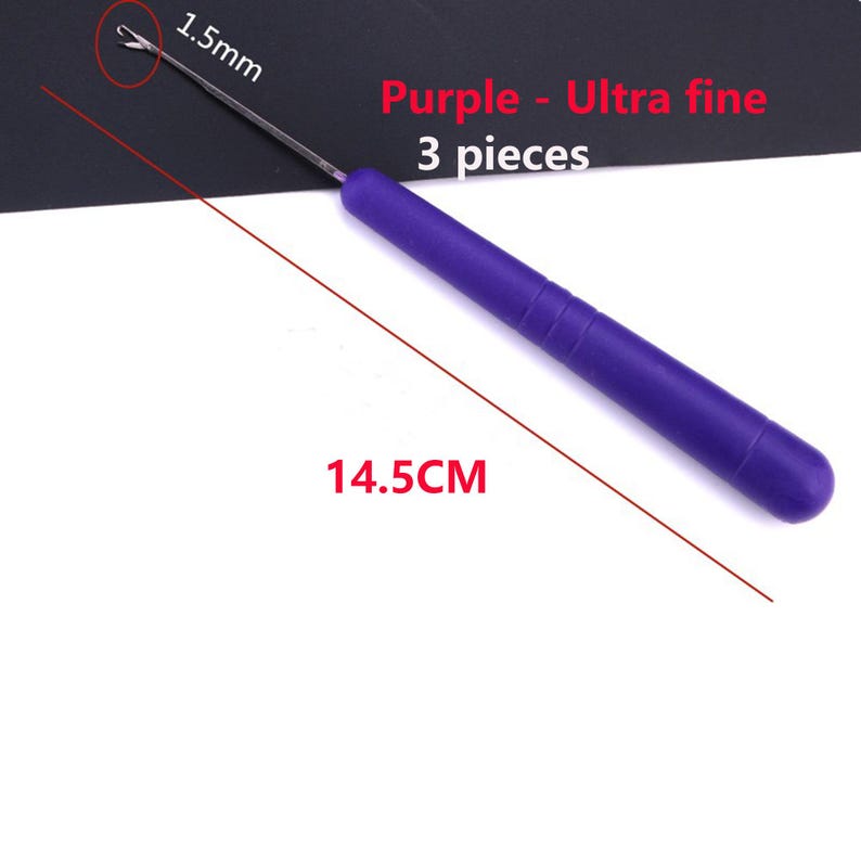 May include: A purple crochet hook with a metal tip, measuring 14.5 cm in total length with a 1.5 mm hook size. The text on the image reads Purple - Ultra fine 3 pieces. This tool features a smooth, cylindrical handle and a fine metal hook.