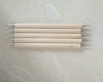 May include: Set of six wooden tools with metal tips for crafting and nail art. The tools have different shaped tips, including a ball, a point, and a flat edge.