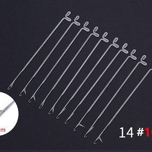 May include: A set of ten silver-colored metal latch hook needles, each featuring a hooked tip and a hinged latch mechanism. A circular inset shows a detailed view of the 1.8mm hook tip. The text 14 #10 PCS is printed in the corner.