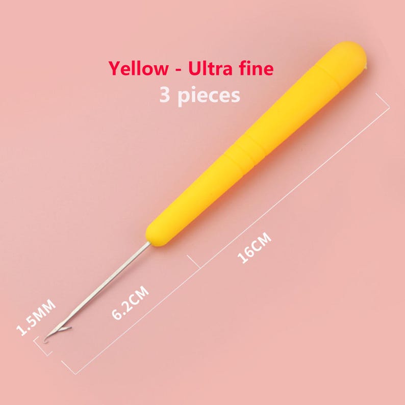 May include: A yellow crochet hook with a 1.5mm tip, a 6.2cm metal shaft, and a total length of 16cm. The text on the image reads Yellow - Ultra fine 3 pieces. This tool features a smooth handle and a fine metal hook for detailed needlework projects.