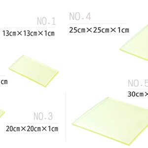May include: Five clear glass plates of different sizes. The plates are labeled with numbers 1 through 5 and their dimensions in inches. The plates are all rectangular in shape.