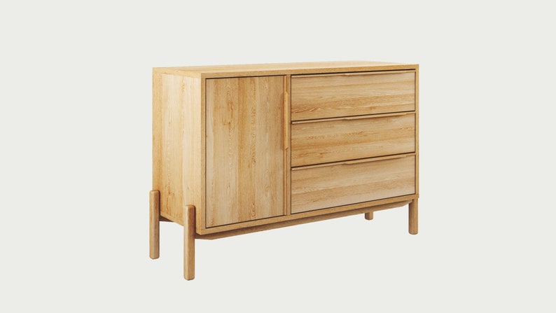 May include: A light wood dresser with three drawers and a cabinet door. The dresser has a modern design with simple lines and a light wood finish.