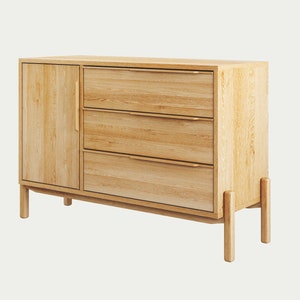 May include: A light wood dresser with three drawers and a cabinet door. The dresser has a modern design with simple lines and a light wood finish.