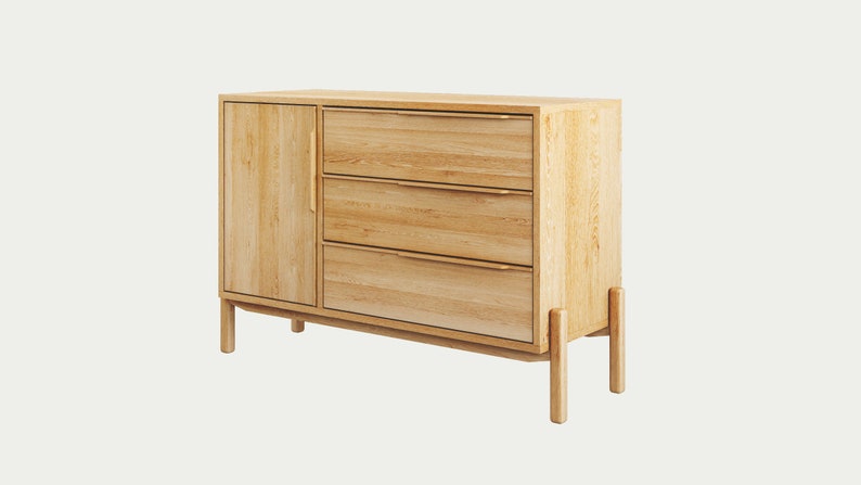 May include: A light wood dresser with three drawers and a cabinet door. The dresser has a modern design with simple lines and a light wood finish.