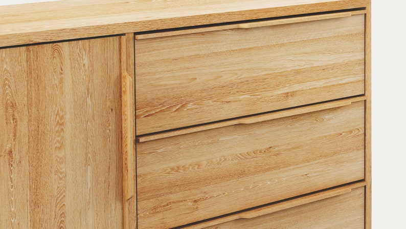 May include: A wooden cabinet with three drawers and a single door. The cabinet is made of light wood with a natural finish. The drawers have simple, recessed handles.