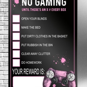 May include: A black sign with pink accents and text that reads "NO GAMING" and a list of chores. The sign includes a pink watercolor-style image of a video game controller. The text "YOUR REWARD IS:" is also included.
