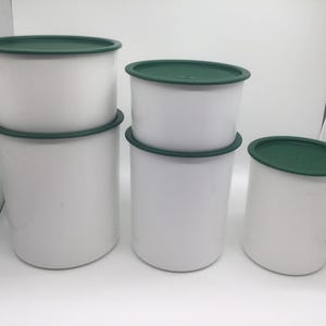 Vintage set of 5 Tupperware canisters with green lids, made in the USA