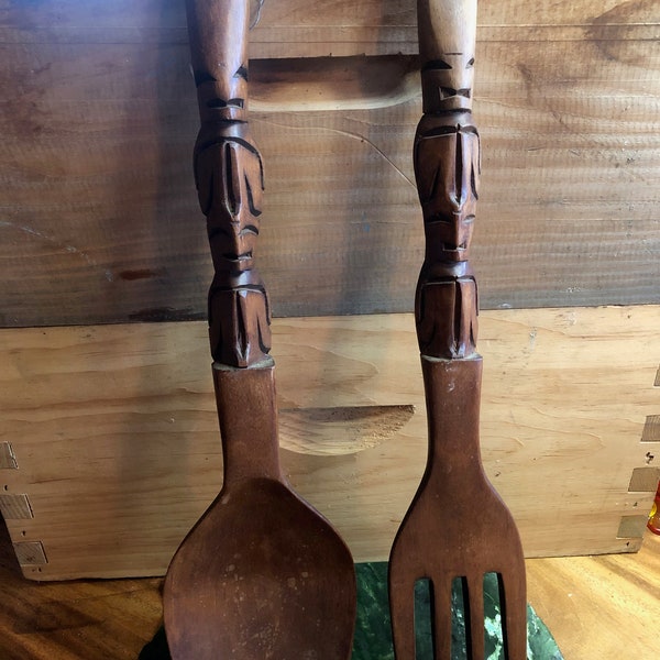 Giant wooden fork and spoon with tiki carved handles