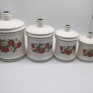 Vintage set of ceramic Strawberry Fields Canisters, 4 canisters and 4 lids
