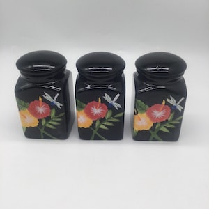 Set of 3 black vintage ceramic canisters with sealing lids and beautiful flowers hand painted on the front
