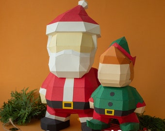 May include: A red and white papercraft Santa Claus and a green papercraft elf stand on a brown surface. The text "PDF DXF SVG" is at the top of the image. The text "Santa + Elf" is at the bottom of the image.