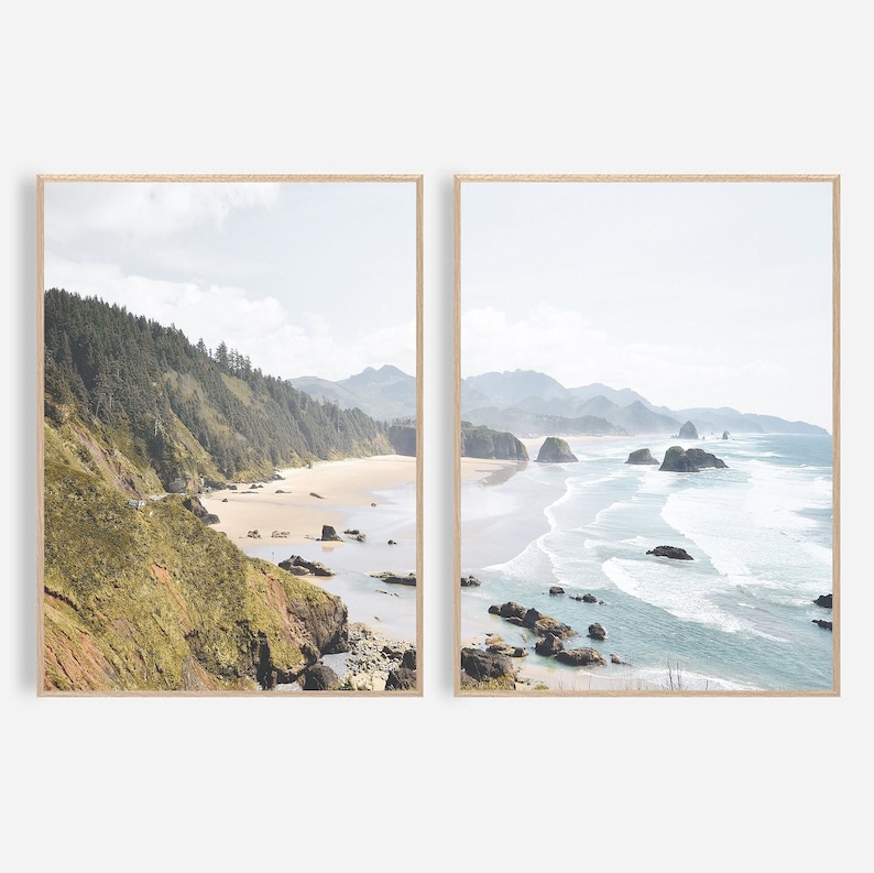 May include: Two framed landscape photographs of a rocky coastline with a sandy beach and ocean waves. The left photo shows a green hillside with trees and the right photo shows a view of the ocean with waves crashing on the shore.