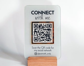 May include: A white acrylic sign with gold trim and a black QR code. The sign reads "CONNECT with me" and "Scan the QR code for my social network @paintwith_emily".