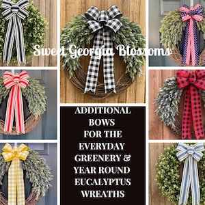 May include: A collection of circular wreaths featuring green foliage and natural vine bases, each adorned with a large fabric bow in various patterns including black and white stripes, buffalo check, red and white stripes, and yellow gingham.