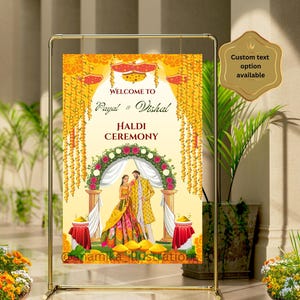 May include: A yellow and red welcome sign for a Haldi ceremony with the names Payal and Vishal. The sign features a couple in traditional Indian clothing standing under a floral archway.